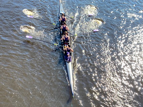The men’s club fours team rows in the Head of the Charles Regatta.