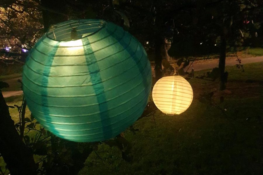Evanston residents gathered under strings of lanterns.